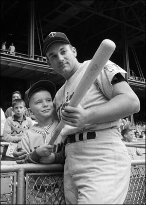 Minnesota Twins' Harmon Killebrew  posing with 9-year-old Johnny Guiney, at New Yorks Yankee Stadium.  Killebrew, the Twins slugger known for his tape-measure home runs, died Tuesday, May 17, 2011, at his home in Scottsdale, Ariz. He was 74. 
