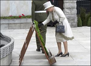 Britain's Queen Elizabeth II lays a wreath in the Garden of Remembrance in Dublin.
