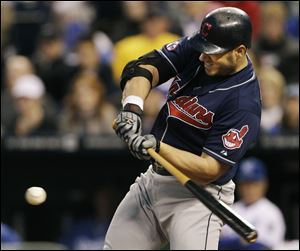 Cleveland's Travis Hafner hits a three-run double off Kansas City Royals relief pitcher Vin Mazzaro in the fourth inning.