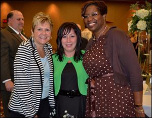 From left, MaryBeth Zolik, Amy Weemes, and Lisha
Washington at the 18th Annual Mom’s Night Out gala.