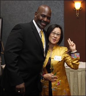 Mayor Mike Bell, shown with Chinese investor Yuan Xiaohona, says Toledo is open for business.