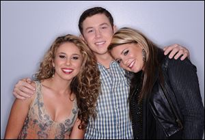 'American Idol' contestants, from left, Haley Reinhart, Scotty McCreery, and Lauren Alaina. McCreery and Alaina will continue to the finale.