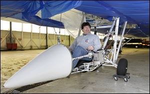 David Miller, in the cockpit of the Dynalifter, is working with the inventor and company founder to resolve financing problems.
