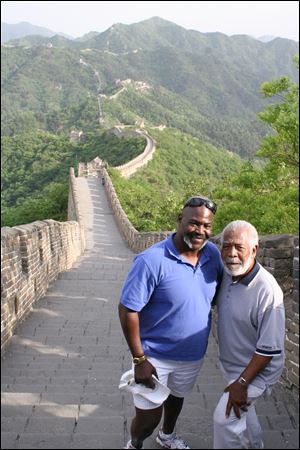 Toledo Mayor Mike Bell, left, and his father, Norman, stand on of the Great Wall of China. 