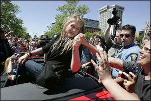 Crystal Bowersox is mobbed by fans as her parade gets underway in downtown Toledo in May of 2010.