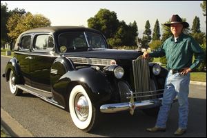 Jim Felt of Glendora, Calif., with his 1940 Packard Super 8 Luxury Sedan, says that once Jerry Brummett's vehicle is fully restored,  it could be worth between $35,000 and $50,000. Mr. Felt said his car, which is a similar model to Mr. Brummett's, has appeared in about a dozen films.