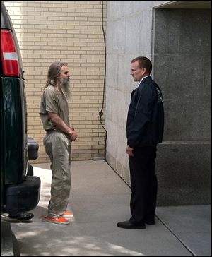 Brian David Mitchell is escorted into the Frank E. Moss Federal Courthouse Wednesday, May 25, 2011, in Salt Lake City. Nearly nine years after she was taken at knifepoint, raped and held captive, Elizabeth Smart is set to publicly confront her kidnapper for the first time,  when Mitchell is sentenced.   