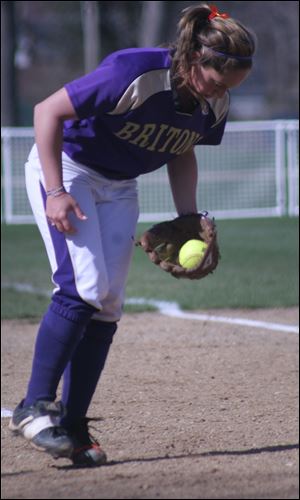 Samantha Kolling, third baseman for the Albion College softball team in Michigan, scoops up a ball.