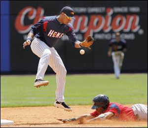 Pawtucket's Matt Sheely steals second as Mud Hens second baseman Argenis Diaz can't handle the high throw from catcher Max St-Pierre