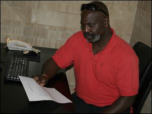 Toledo Mayor Mike Bell reads a letter of intent  from the Dashing Pacific Group to renew its purchase offer for the Marina District in East Toledo, as well as an option to expand the deal to adjacent land near the I-280 bridge, on Thursday in Hangzhou, China.