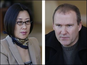 Yuan Xiaohona, left, of Dashing Pacific Group Ltd., and Scott Prephan, a local broker for the firm, speak about Chinese investment in The Docks on March 24 in Toledo.