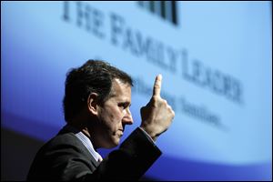 In this May 2, 2011, photo, former Pennsylvania Senator Rick Santorum speaks during a Presidential Lecture Series sponsored by The Family Leader, at Pella Christian High School in Pella, Iowa. 