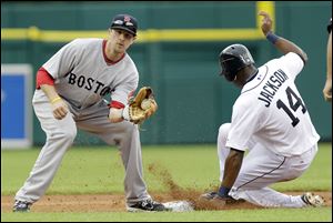 Detroit Tigers' Austin Jackson (14) beats the throw to Boston Red Sox shortstop Drew Sutton to safely steal second base during the third inning.