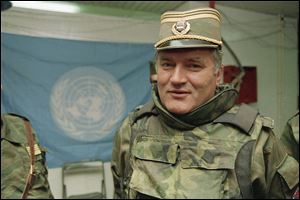 Bosnian Serb commander Gen. Ratko Mladic is shown near a United Nations flag at Sarajevo Airport in a May 17, 1993, file photo