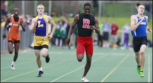 Rogers' DerJuan Gambrell wins the 400 meter dash during the Division I Regional track meet Friday at Amherst Steele High School in Amherst, Ohio.