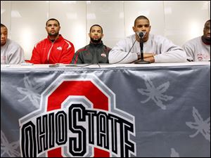 Ohio State football players, from left, DeVier Posey, Mike Adams, Boom Herron, Terrelle Pryor, and Solomon Thomas, at a news conference in Columbus in this Dec. 28, 2010, file photo. The Buckeye players were suspended by the NCAA for the first five games of next season for selling championship rings, jerseys and awards, and receiving improper benefits from a tattoo parlor. 