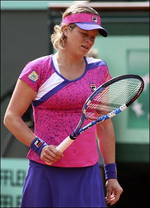 Kim Clijsters tries to compose herself, but she lost 11 of the final 12 games to fall to Arantxa Rus.