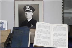A dedication and memorial to Officer Charles W. Roth is one of the many exhibits housed in the Toledo Police Museum. Officer Roth established the Toledo Police Academy in 1938.