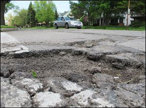A large pothole awaits drivers on Arcadia Avenue at Collingwood Boulevard. Neither of the streets is on the list of worst streets, however. 