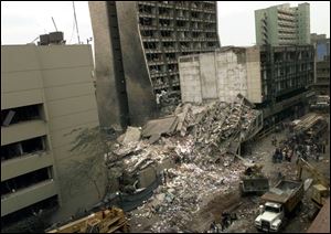This Aug. 8, 1998, file photo shows the United States Embassy, left, and other damaged buildings in downtown Nairobi, Kenya, the day after terrorist bombs in Kenya and Dar es Salaam, Tanzania. Among those killed in Kenya that day were Uttmalal 
