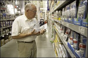 Richard Anderson, 70, a retiree in Greenville, S.C., shops for light bulbs at a home improvement store. An expected increase in inflation is part of the reason for dispelling one myth, that retirees need less income than they had while they were employed.