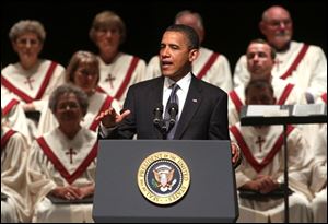 President Obama speaks at a community memorial service at Missouri Southern State University in Joplin, Mo., on Sunday. 