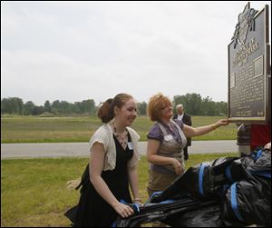 Alexander Drabik's granddaughter Katrina Wilson, left, and her mother, Rita Wilson, unveil the state historical marker erected in Mr. Drabik's honor.