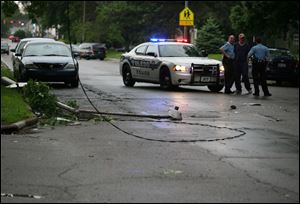 Police barricaded an area where  a street light  came down on Glendale Ave at Kenyon Dr. during the thunderstorms that hit the area Sunday. The street was closed to traffic.