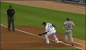In this image taken from video and provided by MLB.com, Cleveland Indians' Jason Donald, right, runs to first base as  Detroit Tigers pitcher Armando Galarraga takes the throw during the ninth inning baseball game Wednesday, June 2, 2010, in Detroit. Umpire Jim Joyce, left,  called Donald safe on the play, then said he got it wrong.