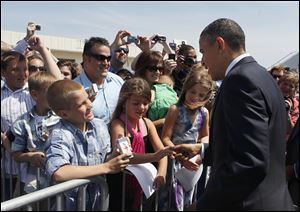President Barack Obama meets the crowd at Toledo Express Airport, including Blake Borowski, 10, of Whitehouse, left. 