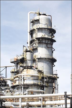 The vacuum and distillation tower at the Husky Lima Refinery is a prominent part of the skyline.
