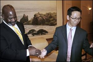 Mayor Mike Bell meets Zhu Haowen, mayor of Qinhuangdao, one of Toledo’s sister cities. The meeting was to build a relationship, key to doing business in China.