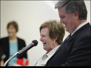 Mary Lou Zaums shares a laugh with Superintendent Ted Magrum as she is honored during a retirement ceremony at Monroe Road Elementary School last week.