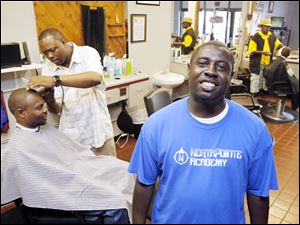 Keith Mothershed is able to keep his barber shop going strong with a business plan from the Toledo Small Business Development Center. The center was recently recognized as the best of its kind in the state.