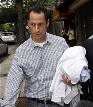 Rep. Anthony Weiner (D., N.Y.) carries his laundry to a laundromat near his home in the Queens borough of New York on Saturday. The 46-year-old congressman acknowledged Friday that he had online contact with a 17-year-old girl from Delaware but said there was nothing inappropriate.