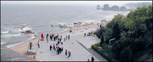 The beach at Qinhuangdao is viewed from atop the Dragon's Head, which marks the beginning of the Great Wall of China.