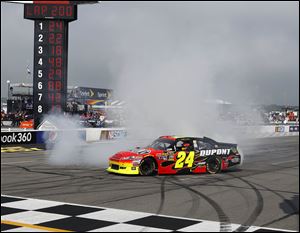 Jeff Gordon does a burnout after winning the race for his 84th career win in the NASCAR Sprint Cup Series. It is his 2nd win of the season, giving him a good chance at qualifying for the Chase.