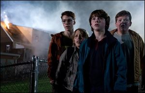 In this film publicity image released by Paramount Pictures, from left, Gabriel Basso, Ryan Lee, Joel Courtney and Riley Griffiths are shown in a scene from 