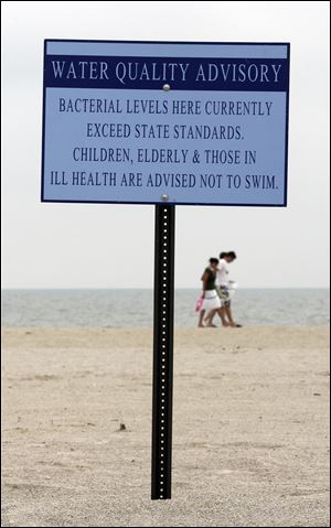 A new online service supplements waterquality signs such as this at Maumee Bay.