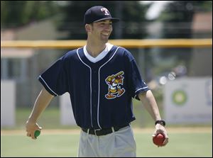 Mud Hen Robbie Weinhardt winds up to deliver a pitch to athletes of the Miracle League of Northwest Ohio. 