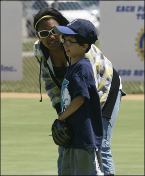 Sabrina Niezgoda and brother Kyle plot strategy during the league’s one-inning All-Star Game.