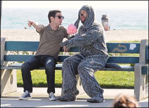 Elijah Wood plays Ryan, a neurotic single guy who attempts suicide in the first episode, in the new FX comedy 'Wilfred.' Australian Jason Gann plays wise-cracking Wilfred. 