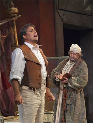 Matthew Polenzani, left, performs as Ernesto opposite John Del Carlo as Don Pasquale during a dress rehearsal at the Metropolitan Opera. The production will be presented as part of the opera's 'Live in HD' series Wednesday at RAVE Fallen Timbers.