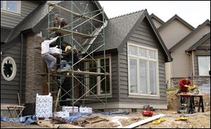 Construction is under way on a home in Beaverton, Ore. Home construction rose last month to a seasonally adjusted annual rate of 560,000 units per year, according to the Commerce Department. 