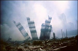 The remains of the World Trade Center stands amid the debris following the terrorist attack on the building in New York  in this Sept. 11, 2001, file photo. Steel pieces from the building are being sent around the country to be part of memorials, one of which will be in Wauseon, Oho.