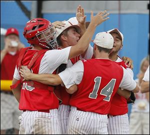 The Kicking Mules mob each other after downing Sterling Heights Stevenson 10-5 in Division I semifinal action.