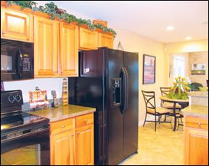The kitchen is open to the great room, and includes space for informal dining.