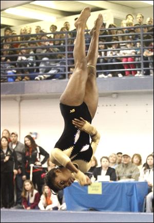 Perrysburg’s Chelsea Williams competes in the floor exercise in the district tournament in February at the YMCA in Perrysburg. She was fourth in the all-around at the YMCA national event in last year in San Diego.