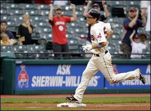 Cleveland Indians' Cord Phelps rounds third after his game-winning, three-run home run against the Pittsburgh Pirates in the 11th inning of an interleague baseball game on Sunday, June 19, 2011, in Cleveland. Phelps's first major league home run gave the Indians a 5-2 win and a three-game sweep over Pittsburgh. 