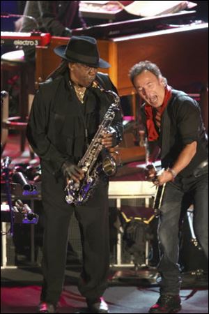 Clarence Clemons, left, performs at the Stone Pony with Bruce Springsteen. The larger-than-life saxophone player who helped catapult Bruce Springsteen to rock fame, was known as 